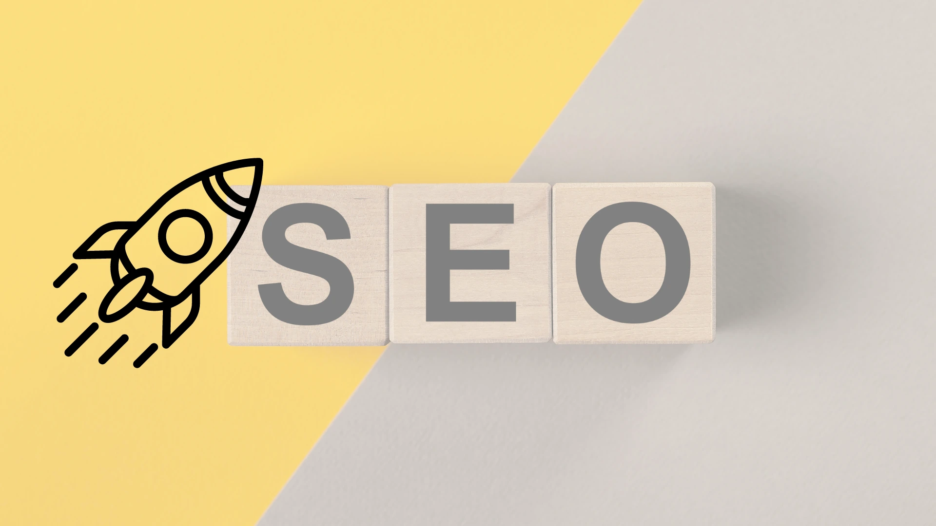 Cubos de madera que forma la palabra SEO en un fondo amarillo y gris