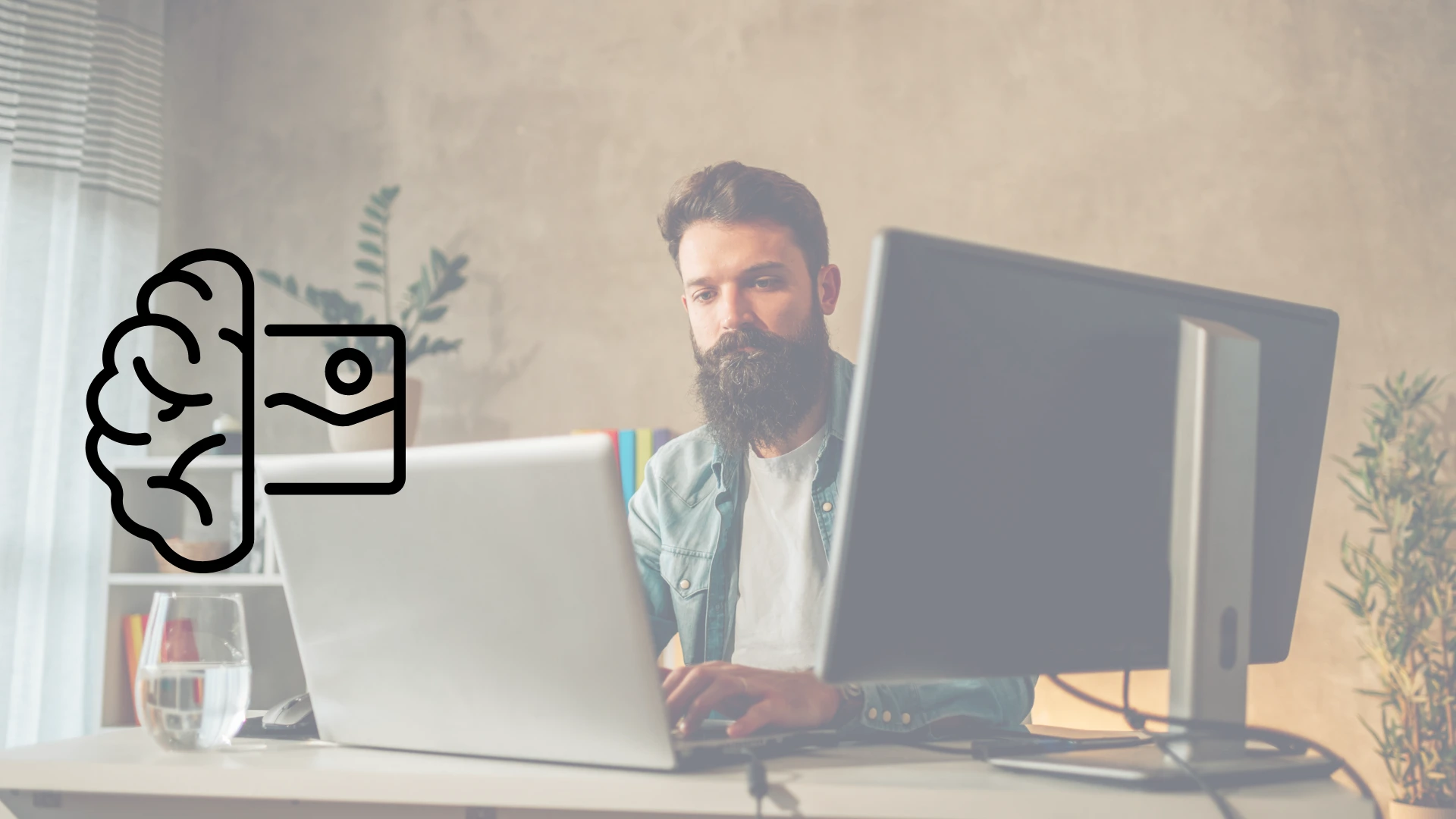 Hombre con vestimenta informal trabajando en una oficina casual en computadora de escritorio